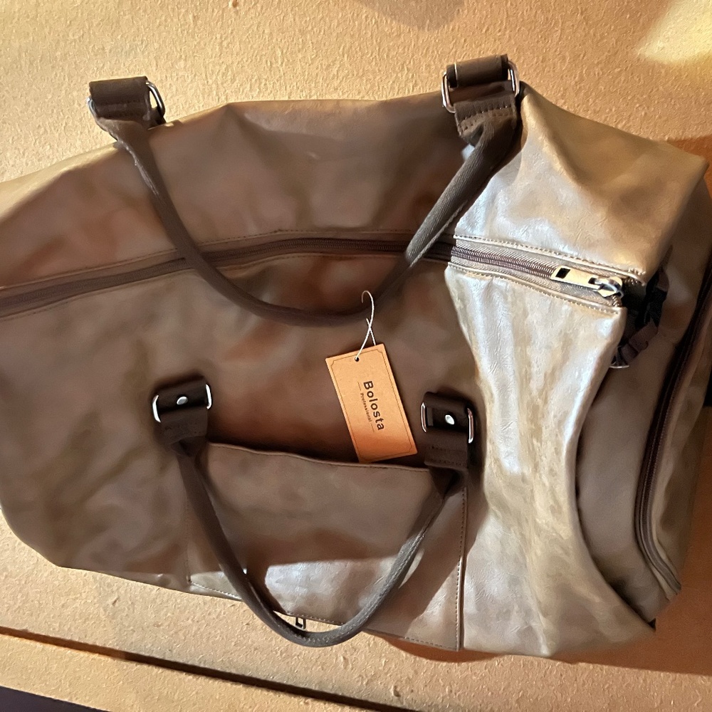 Leather carry on garment bag for travel